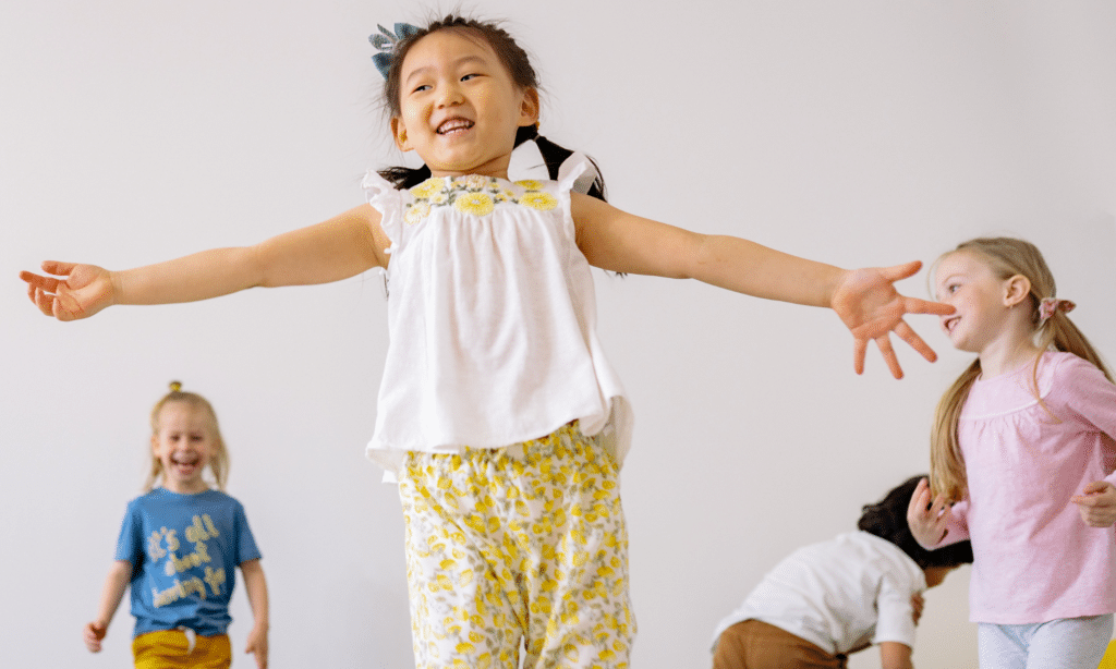 Group of 4 year old children playing together